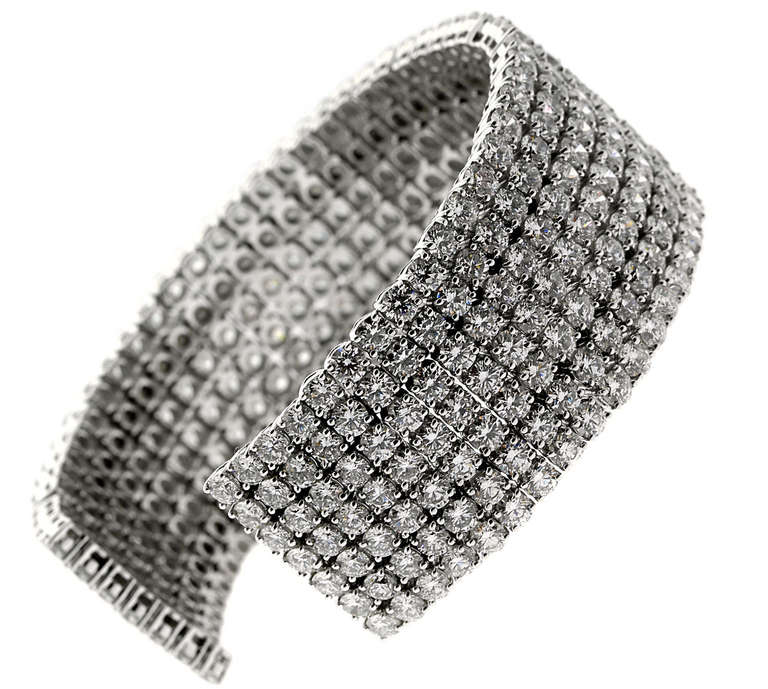 This impressive 18k White Gold Diamond cuff bracelet is adorned with 350 Round Brilliant Cut Diamonds, totaling 36.47 carats, weighing 56.1 grams.

The diamonds range from Vs2-Si1 Clarity with a G-H Color.