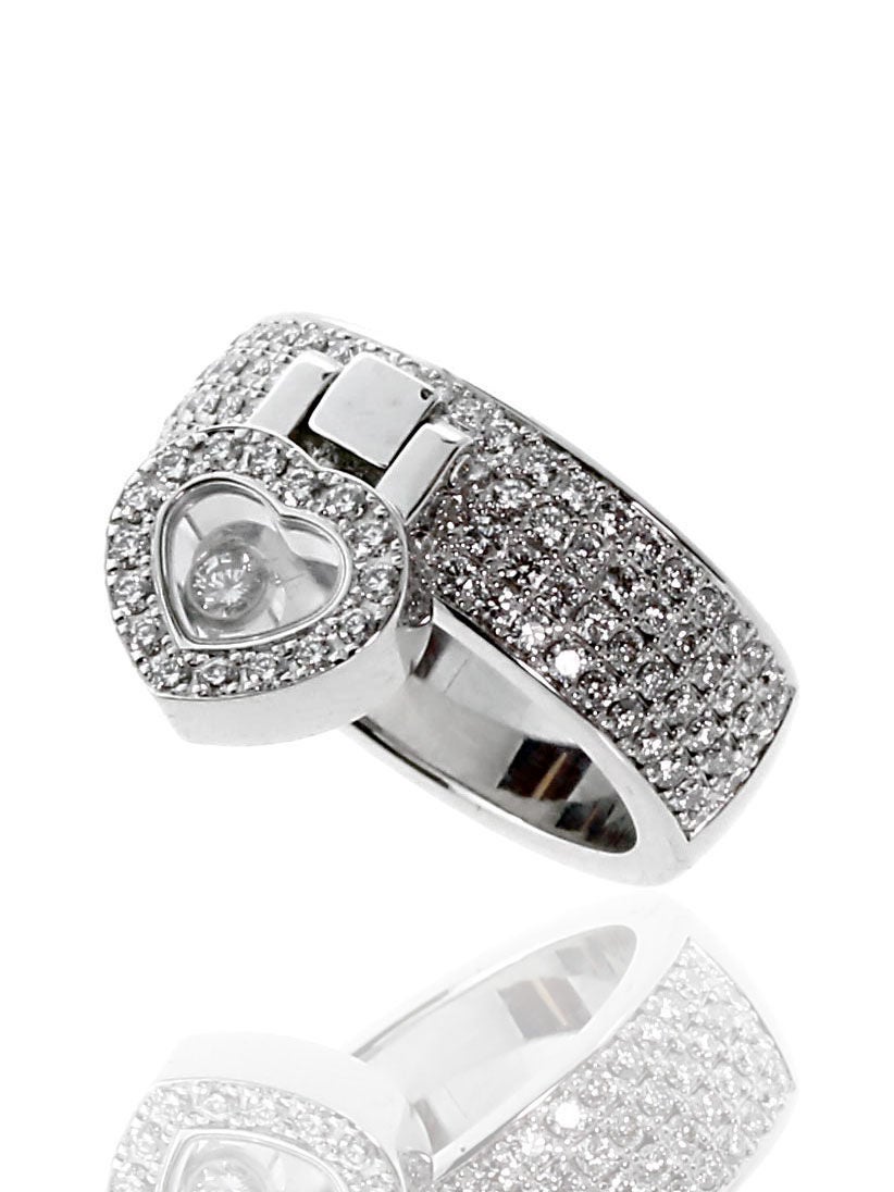 A fabulous authentic Chopard Happy ring set 111 of the finest Chopard round brilliant cut diamonds in 18k white gold. The ring features a heart charm dangling from the center. 

Size: US 5
Dimensions: The band has a width of 6.5mm (.23″