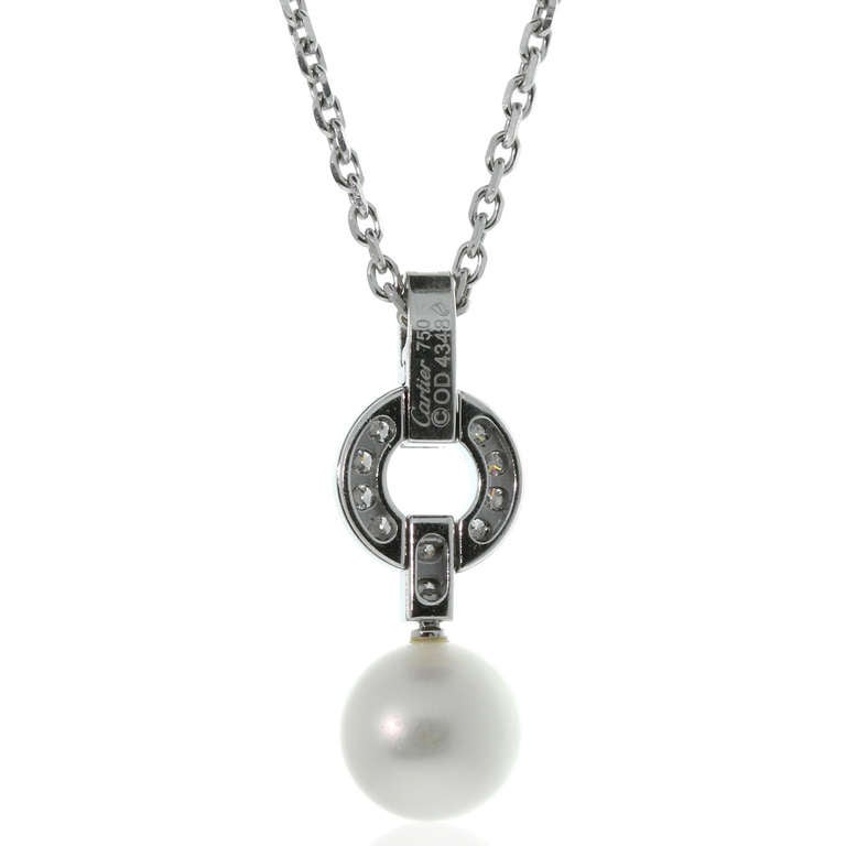 A fabulous authentic Cartier diamond and pearl pendant set with the finest Cartier round brilliant cut diamonds in 18k white gold.

Necklace Length: 15″
Pendant Dimensions: .39″ Inches wide by 1.10″ Inches long

Opulent Jewelers Inventory ID: 0000090