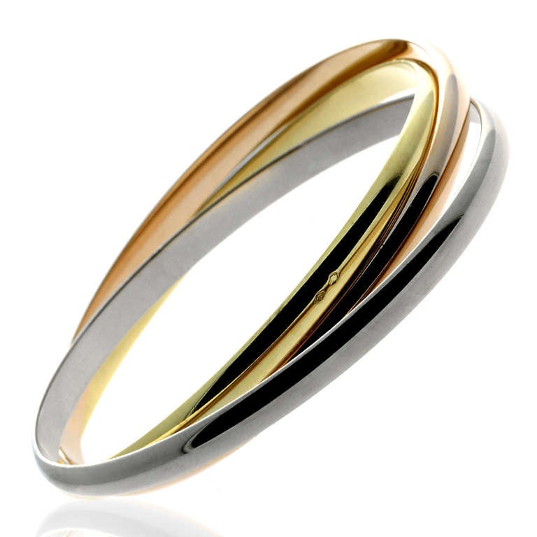 With 3 individuals bands composed exclusively of either 18k Yellow, Rose, or White Gold, this Trinity bangle bracelet by Cartier proves once and for all that jewelry can be luxurious and colorful at the same time. This bangle’s enticingly smooth