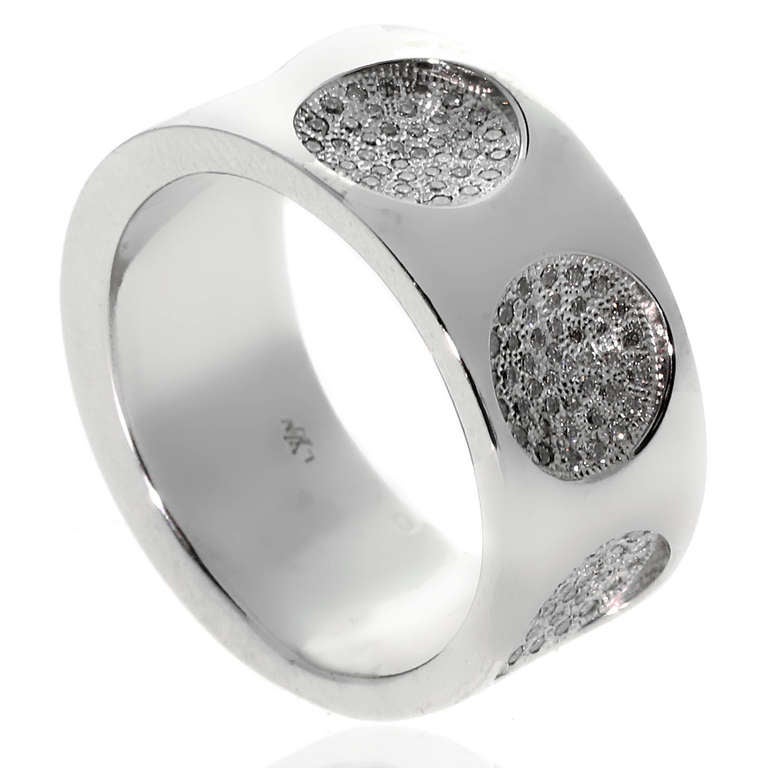 This stunning Louis Vuitton ring from the Empreinte collection is adorned with .85ct of Vvs1 E-F Color Round Brilliant Cut Diamonds, leaving 1 circular indentation with Louis Vuitton engraved in it. This ring is a sz 52, crafted in 18k White Gold,
