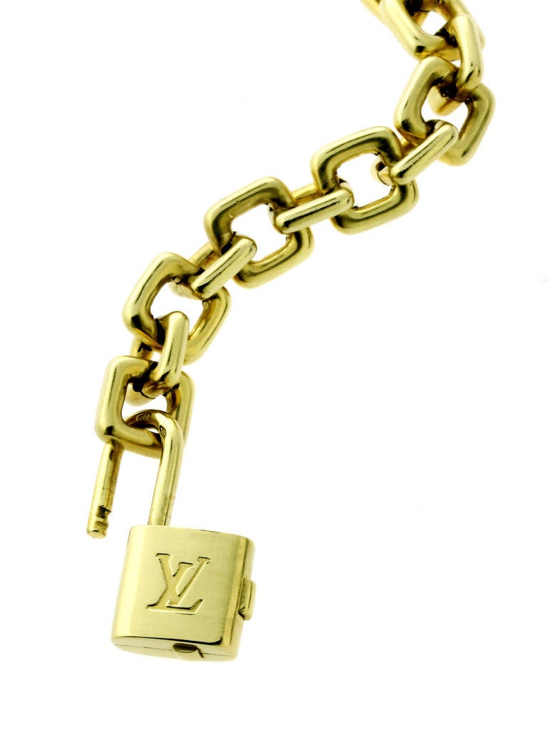 This stunning bracelet from Louis Vuitton features a fully functioning removable lock which acts as the clasp as well, The bracelet is crafted in 18k Yellow Gold, measures 6 3/4