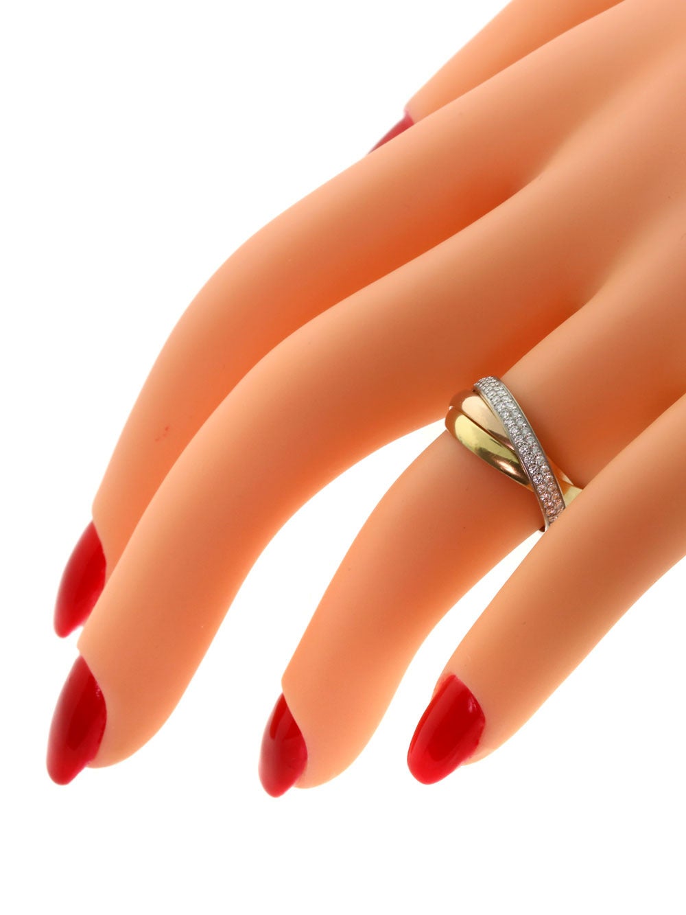 This Cartier Trinity diamond ring is sure to glamorize the hand of any woman who chooses to wear this truly special and memorable creation. The three rings of white, yellow, and rose gold interlock and connect to create an emblematic effect that the