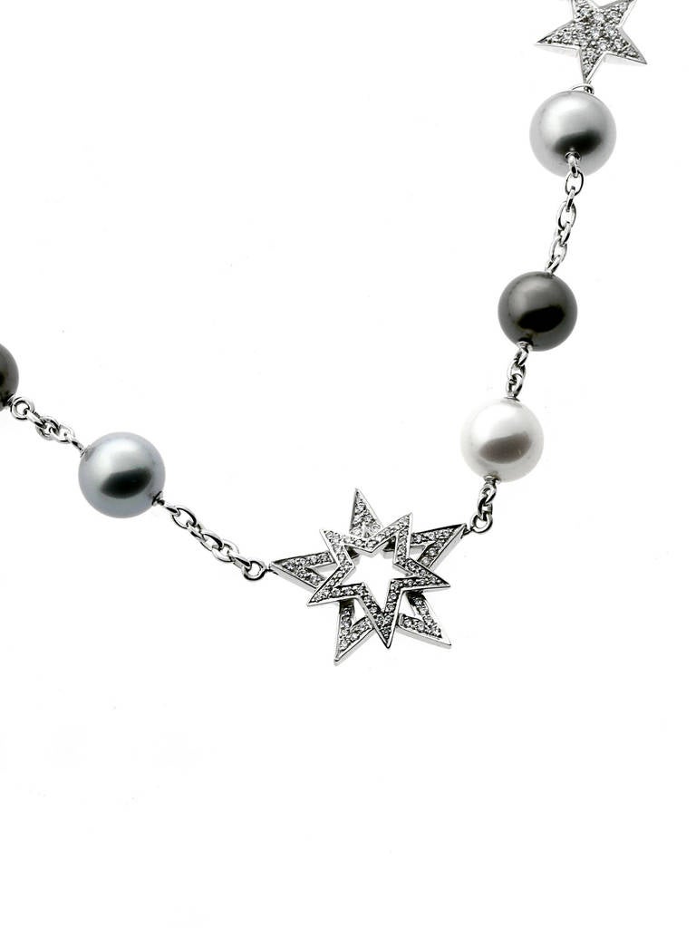 This stunning necklace from Chanel's exclusive High Jewelry line features 3 South Sea (White), 8 Tahitian Pearls, followed by 136 Round Brilliant Vvs1 FG Color (1.33ct) diamonds. The necklace has a weight of 24 grams, and a total length of 15,5