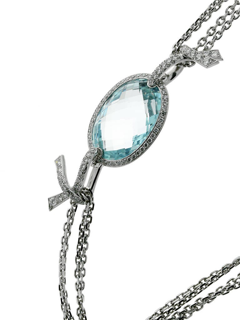 An extravagent authentic Chanel tassle necklace glittering from every angle thanks to the 262 Chanel round brilliant cut diamonds (4.42ct total), 12 smaller Aquamarine stones (13.9ct total), and 1 Aquamarine (22ct) which serves as the focal point.
