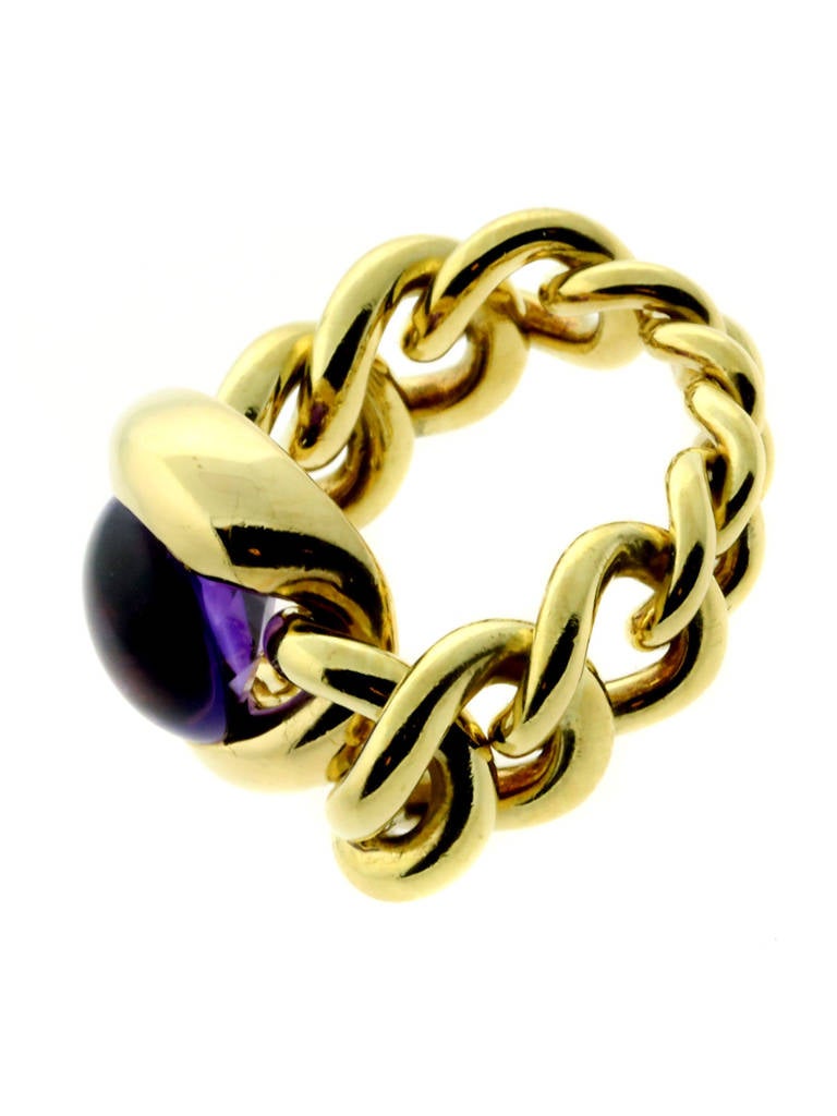 A fabulous authentic Chanel chain link ring featuring a vivid amethyst set in luxurious 18k yellow gold.

Size: US 5 1/2
Dimensions: .55