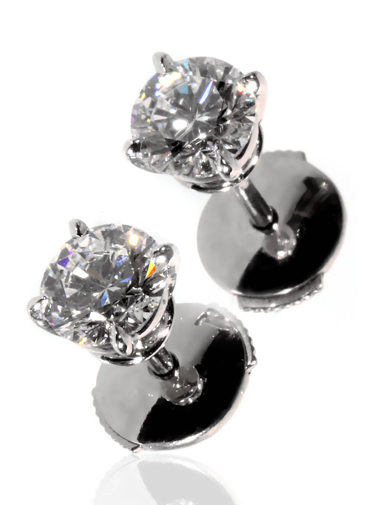 The perfect diamond studs for everyday wear or a special evening, boasting (1) .72 Vs1 E Color round brilliant cut diamond, and 1 (.71) Vs2 E Color round brilliant cut diamond. These spectacular studs are crafted in platinum, and have a weight of