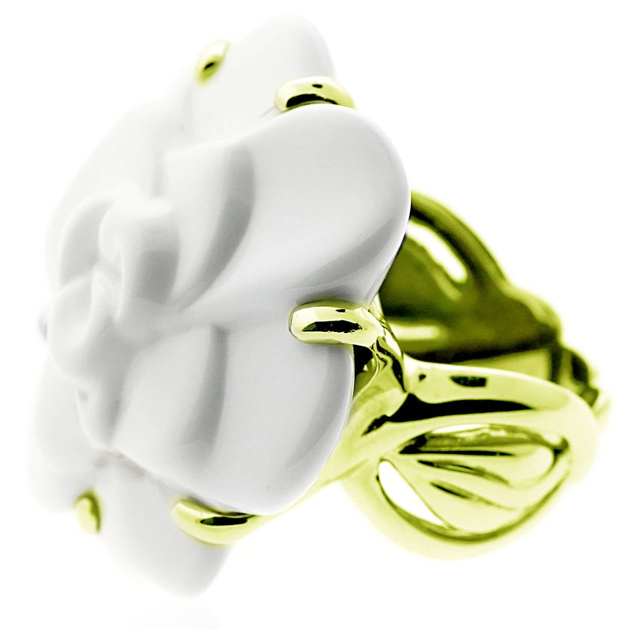 Beauty, and elegance are wrapped around this Camellia ring by Chanel. The centerpiece is a White Agate stone carved to a Camellia flower. The ring is crafted in 18k Gold, Size 5.75, and has a total weight of 21.5 grams.