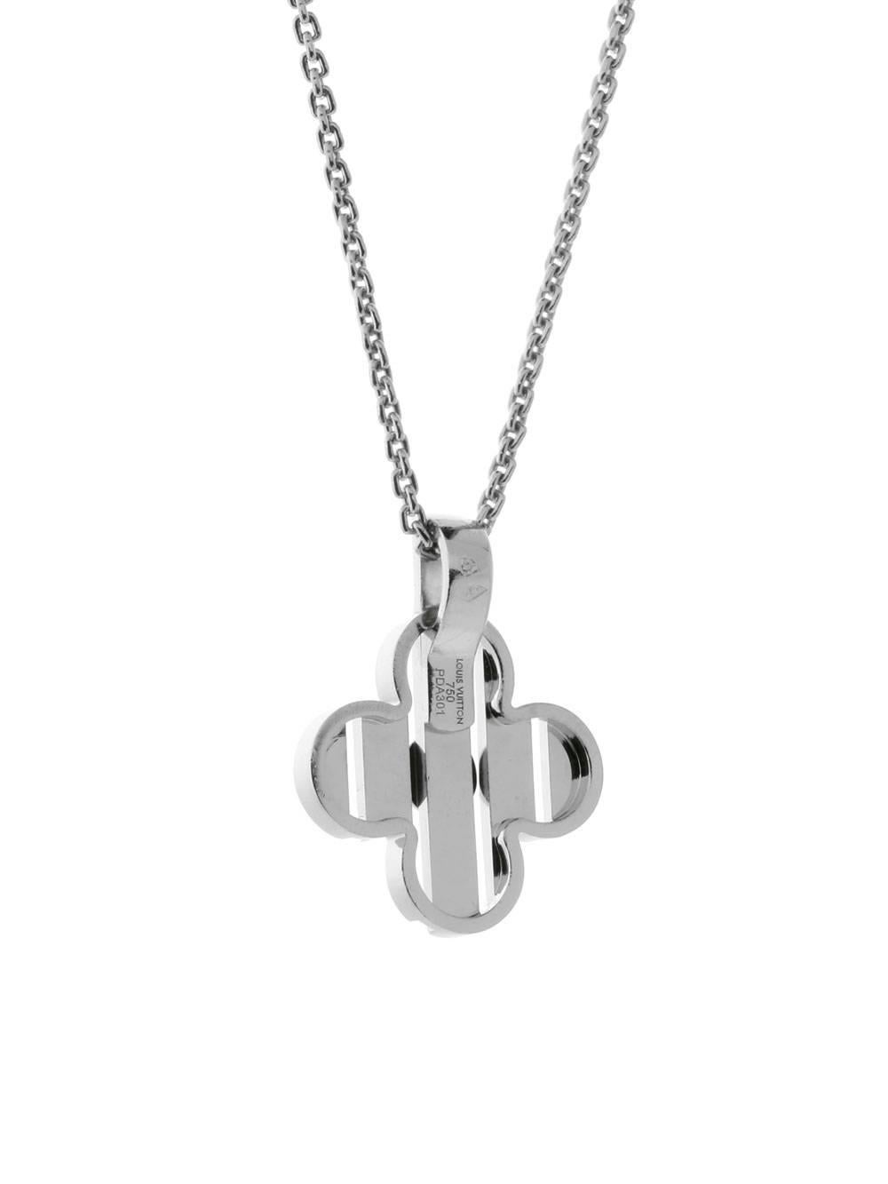 A playful, chic diamond necklace by Louis Vuitton featuring the signature Fleur motif adorned with 1 round brilliant cut diamond, suspended by a Louis Vuitton 18k white gold necklace measuring 16