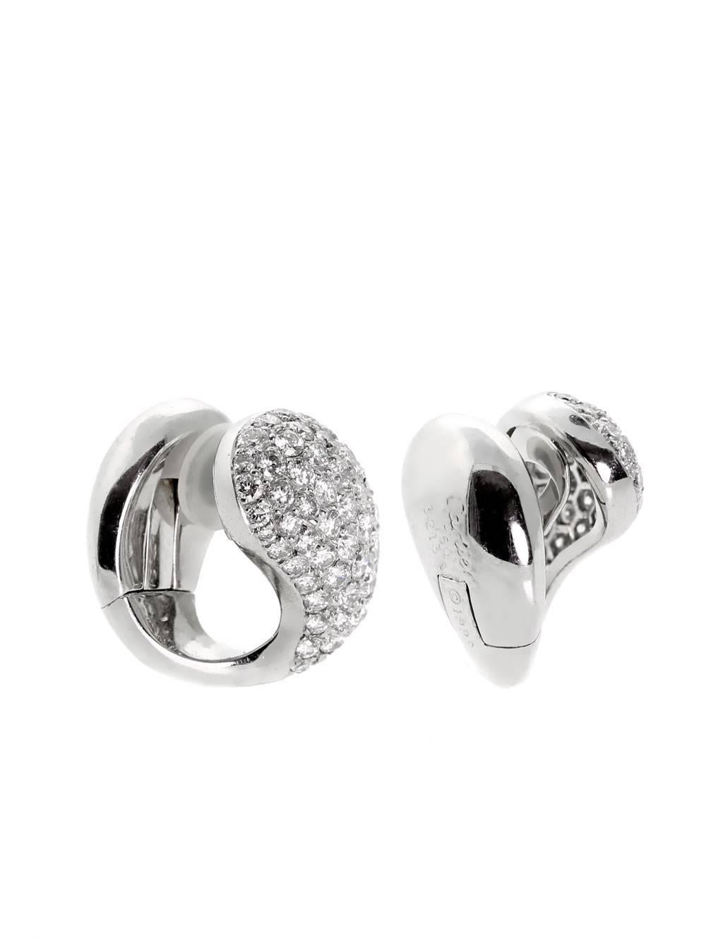 There is but one word in the English language which accurately captures the fundamental essence of these 18k White Gold Pave Diamond Earrings by Cartier: Astounding! A veritable bounty of Vvs1 Clarity E-F Color Round Brilliant Cut Diamonds grace the