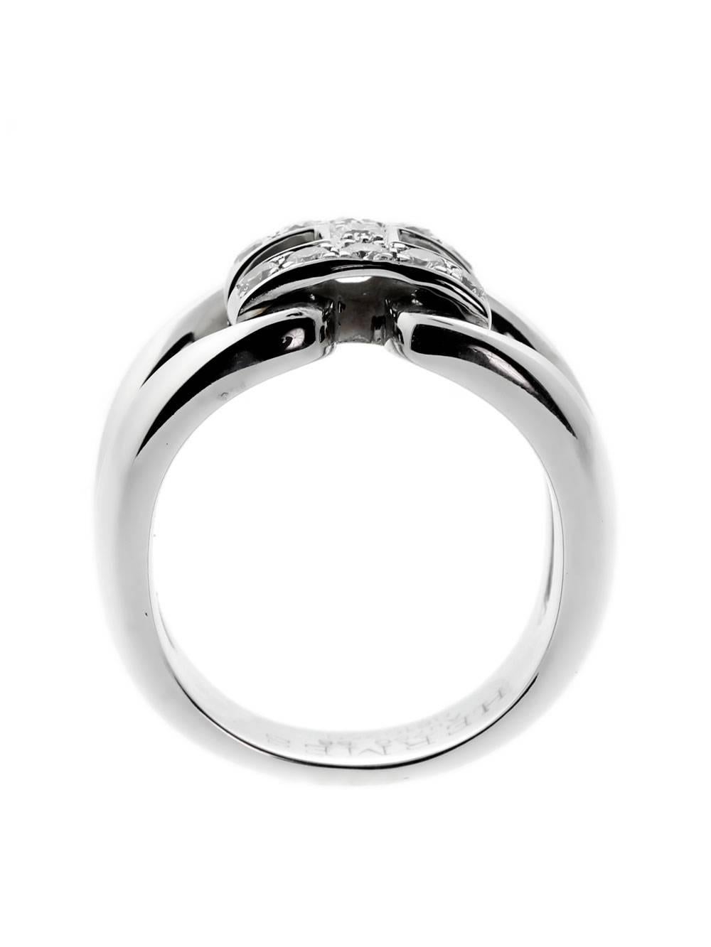 When you slip a diamond Hermes ring on your finger, subtle elegance and grace will be yours. Made from 18k white gold and featuring an abundance of diamonds, the ring radiates class. The accessory’s centerpiece is formed into the company’s famous H
