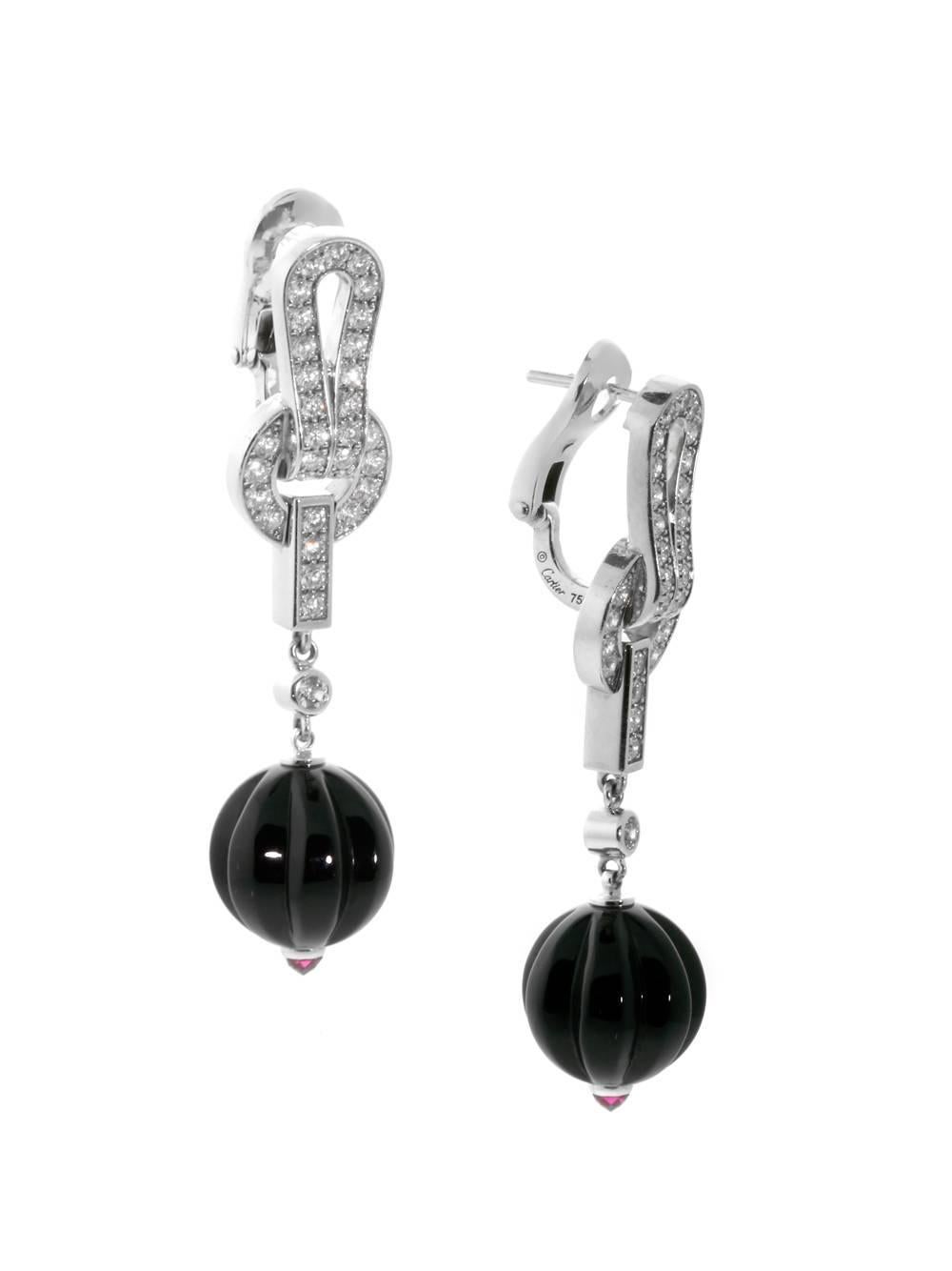 A fabulous pair of authentic Cartier diamond earrings featuring carved onyx and brilliant white round diamonds.

Length: 1 3/4″

Inventory ID: 0000073