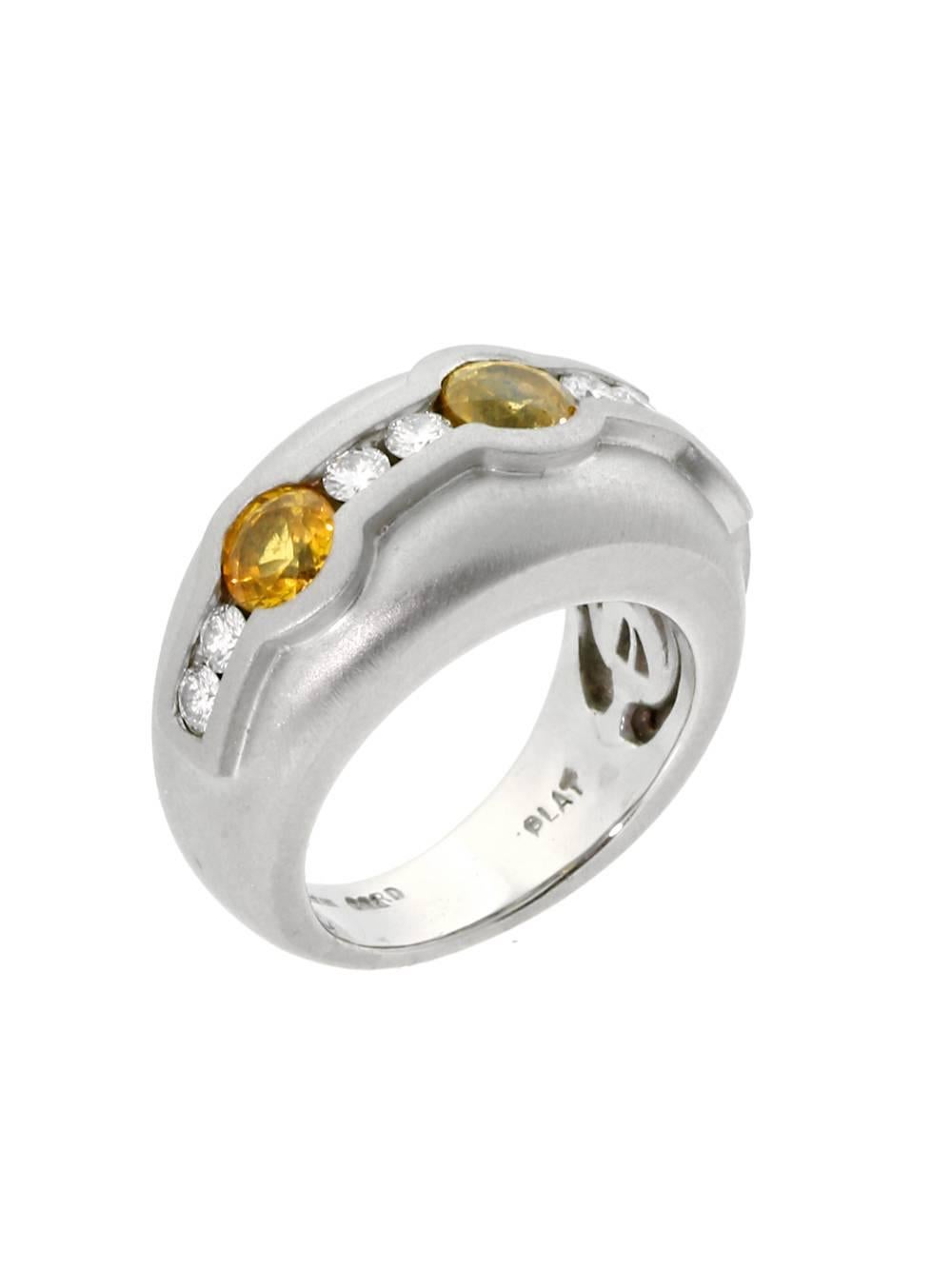 A phenomenal platinum ring by Barry Kieselstein, featuring an alternating pattern of Vs1 E-F Color Diamonds and brilliant Yellow Sapphires.

Dimensions: 12mm Wide (.47″ Inches)
Size: US 5

Inventory ID: 0000304