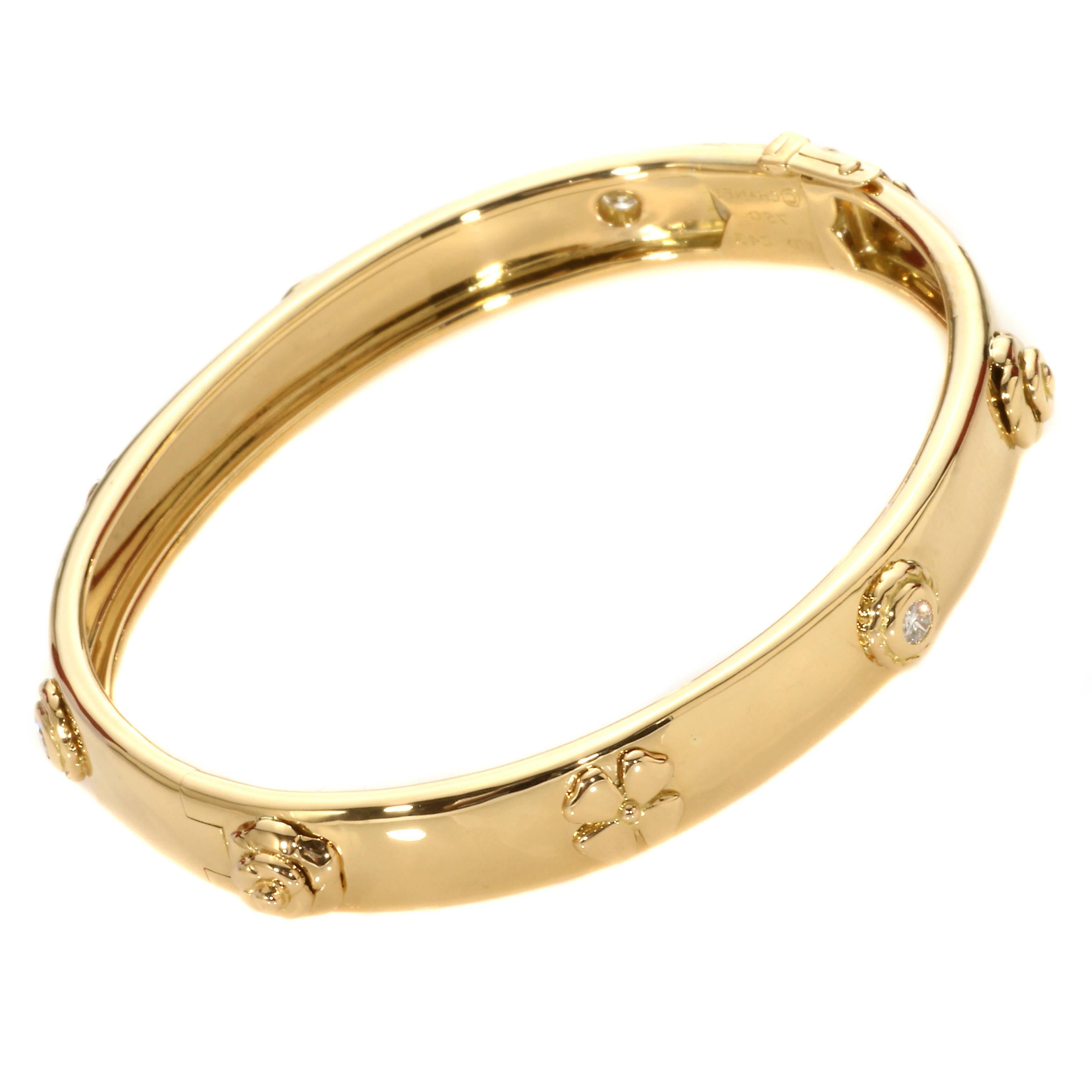 An exceptional Chanel 18k yellow gold diamond bangle part of the posh Caméllia collection, this bangle also features several of Chanel’s iconic Camellia flower icons.

Inventory ID: 0000035