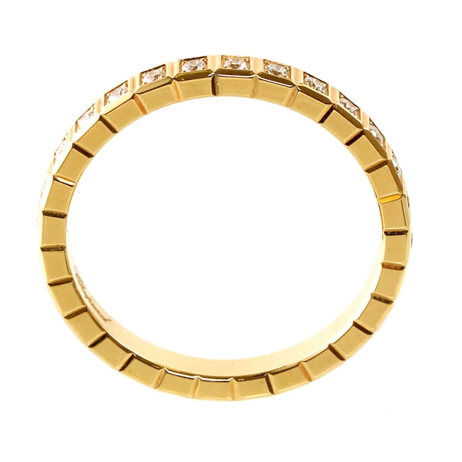 A beautiful 18kt yellow gold Chopard Eternity diamond ring featuring an Ice Cube designed adorned with 28 Round Brilliant Cut Diamonds (,31ct) into a brilliant, glittering loop around the entire Band.

Size: 7 1/4 US
Dimensions: The band measures