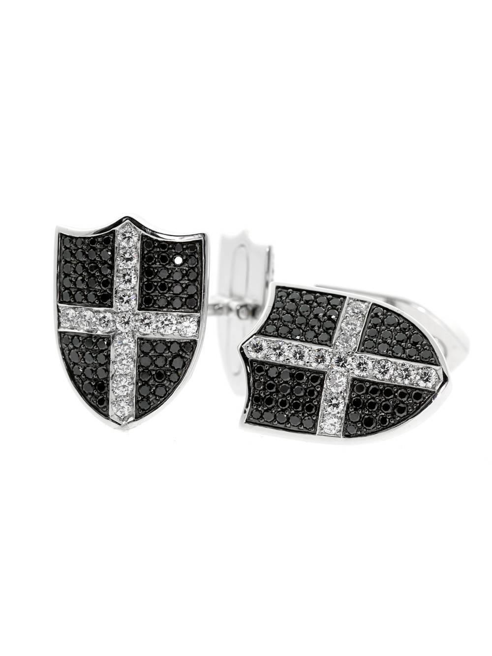 Stunning diamond cufflinks by Garrard made from 18-karat white gold, featuring a shield motif adorned with 4ct of black and white diamonds.

Made of 18K White Gold
Hallmarks: Garrard, Austria, 750
Weight: 21.0 Grams
Dimensions: