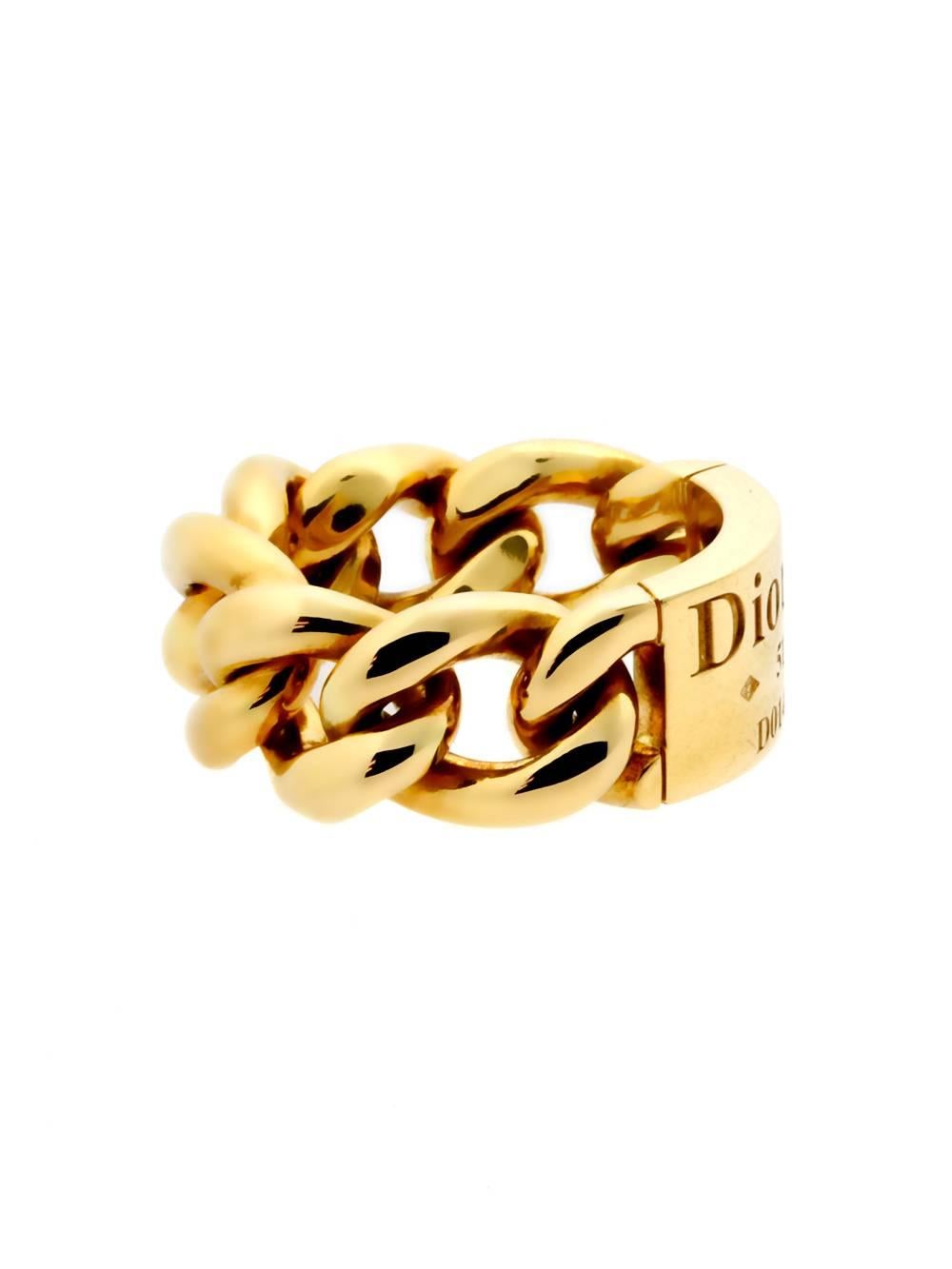 Christian Dior gold “Gourmette” featuring an engraved plaque encircled by a fabulous chunky gold chain-link band. This chic ring screams fun and can be worn with any outfit!

Made of 18k Yellow Gold
Hallmarks: Dior, 750, 51, Unique Serial