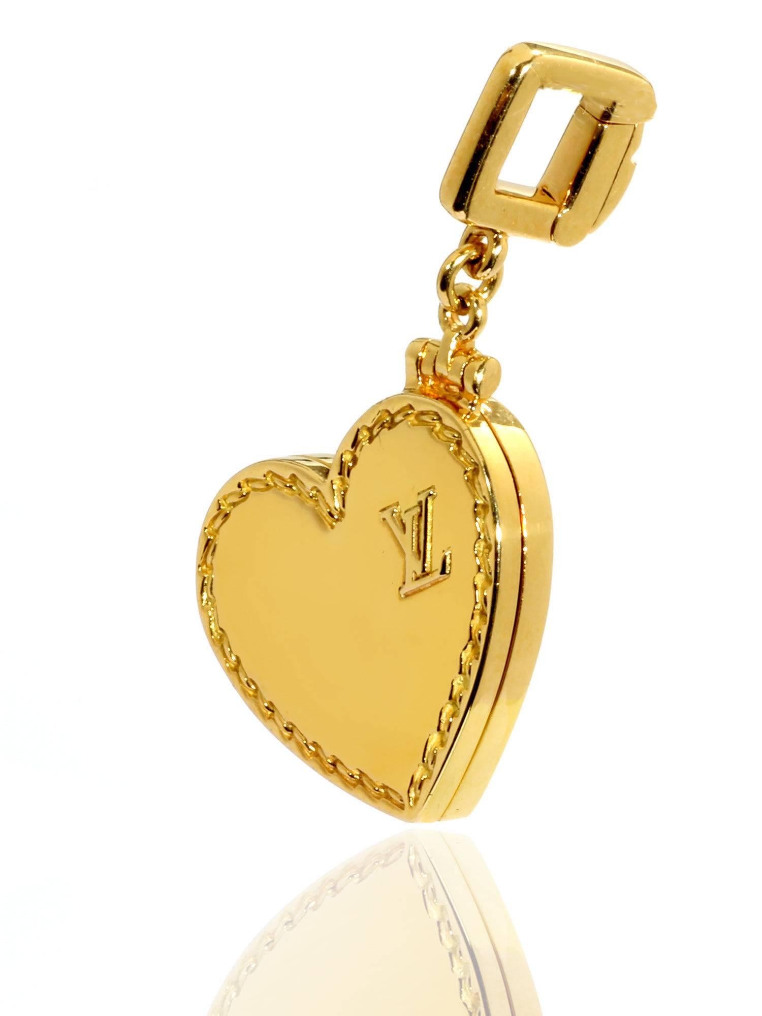 It’s often said that the most passionate of lovers always wear their hearts on their sleeves, but when it comes to this 18k Yellow Gold Heart Locket Charm Pendant by Louis Vuitton, it might be more accurate to say that they wear it on their Charm