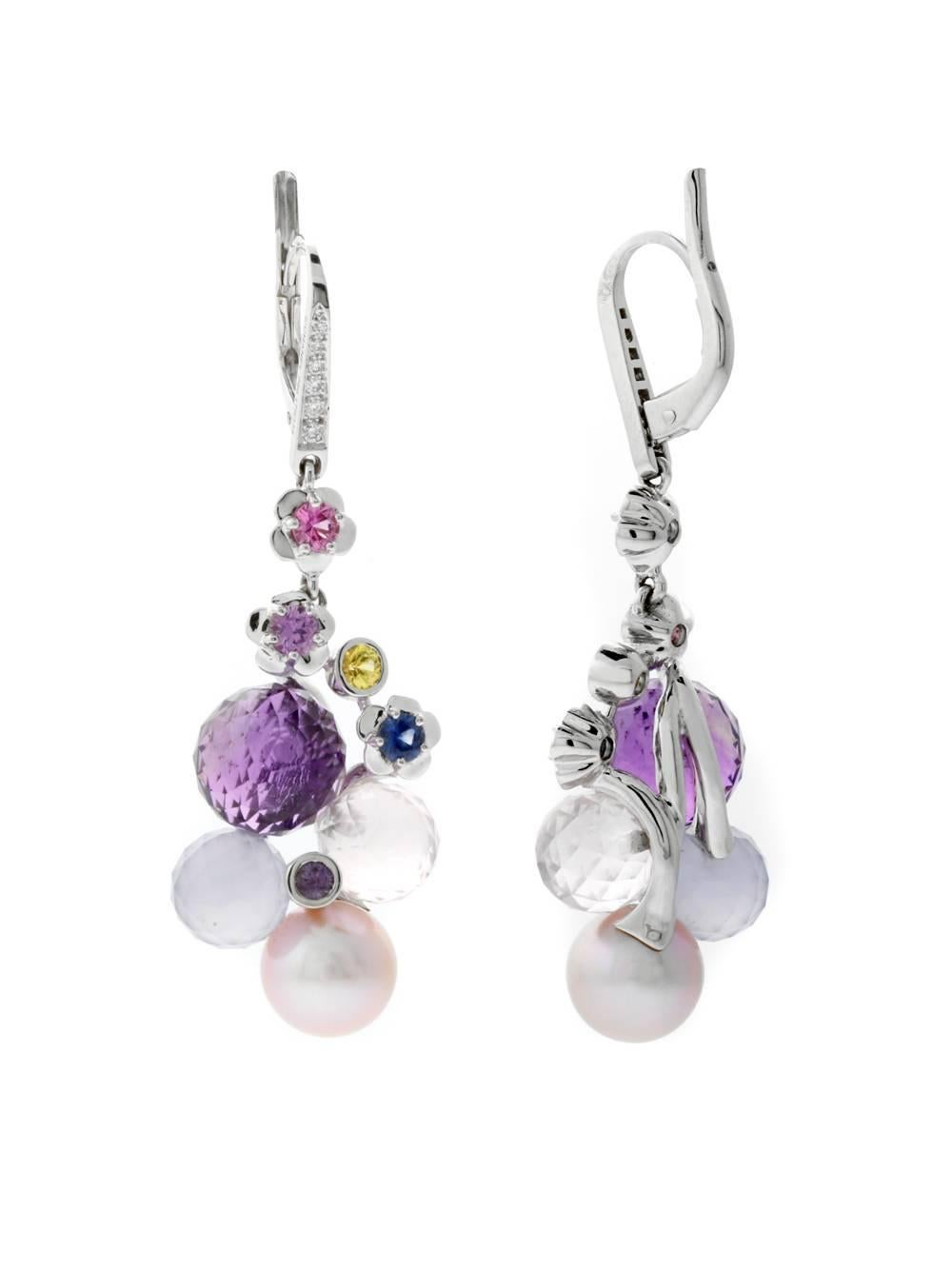 These magnificent Chanel 18k white gold earrings offer an interesting mixture of textures and shapes. Its larger vibrant presentation will help it get noticed.

Stones: Diamonds, Pearl, Amethyst, Pink, Blue & Yellow Sapphire,