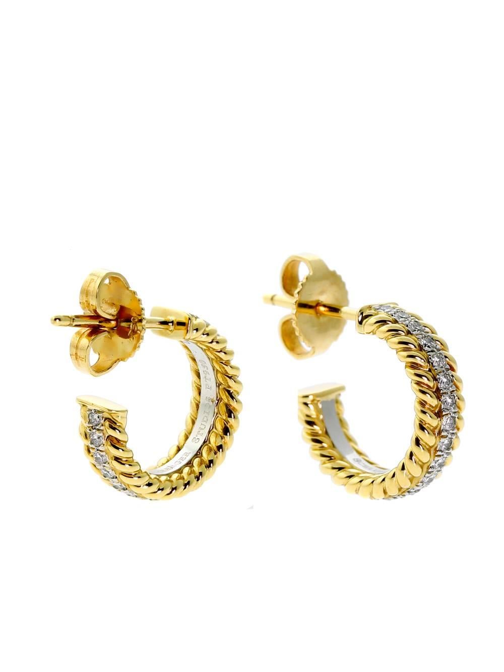 A stunning authentic pair of Tiffany & Co Schlumberger diamond earrings set in platinum bordered with elegant twisted 18k yellow gold ropes.

Diamonds: .60ct Vs1 E-F Color Round Brilliant Cut Diamonds

Dimensions: 13.5mm in circumference (.53
