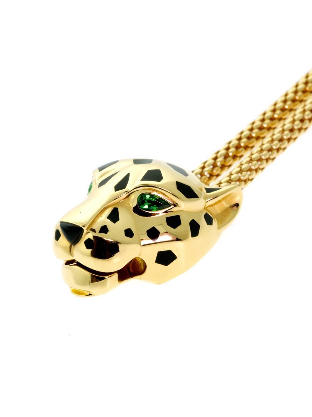 Detailing and one-of-a-kind design elements come together to form Cartier’s Panthere bracelet. Black spots adorn the animal’s head while Tsavorite eyes create a menacing glow. Made from 18-karat yellow gold and featuring Onyx, Tsavorite garnets and