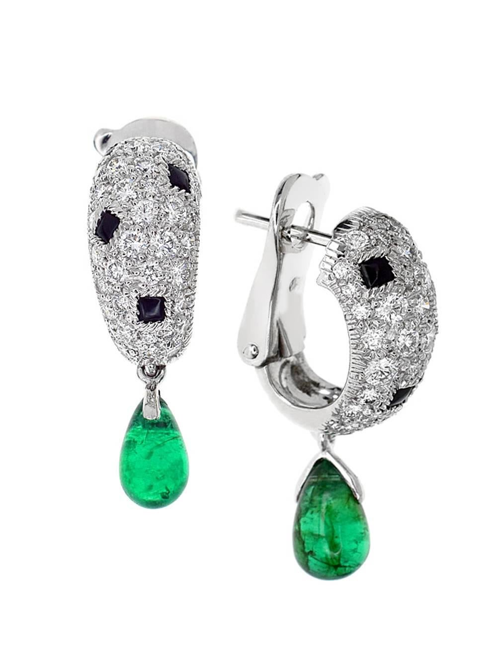 An elegant pair of Cartier earrings, featuring 1.5ct of round brilliant cut diamonds, onyx and lush green hanging emeralds

The earrings have a length of .94