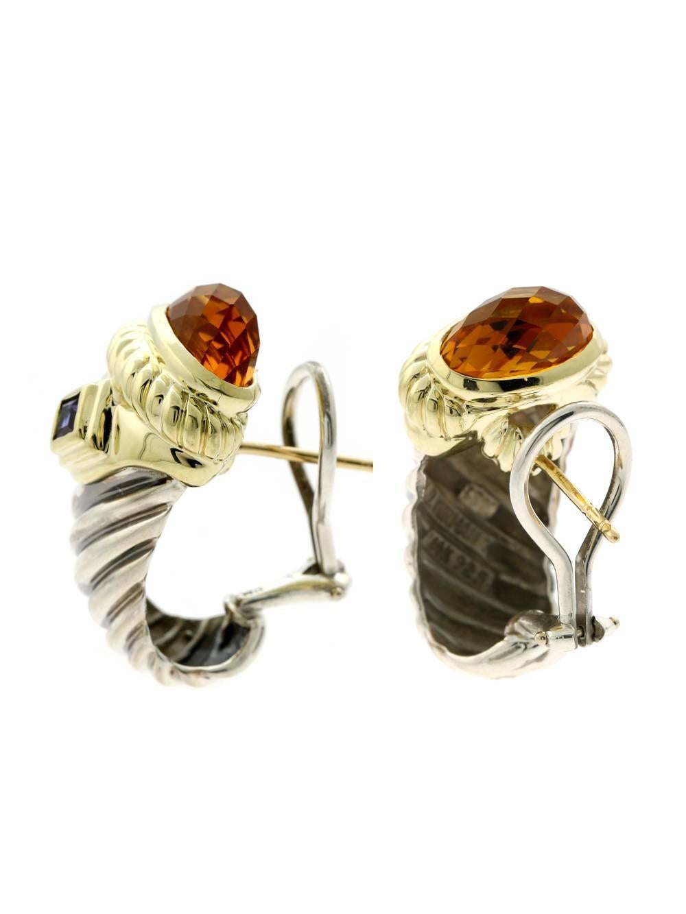 A fabulous pair of David Yurman earrings featuring yellow gold contrasting with silver. The earrings have a faceted Citrine at the top followed by a square step cut Iolite.

Inventory ID: 0000368