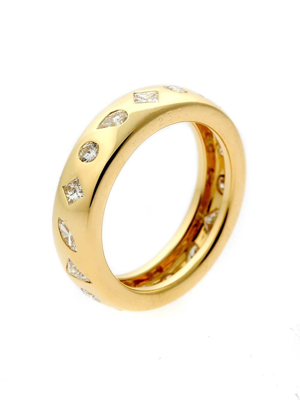 A magnificent Chanel diamond eternity ring featuring round brilliant, princess, pear and trillion cut diamonds set in 18k yellow gold.

1.50ct appx, Size 7 1/2

Inventory ID: 0000374