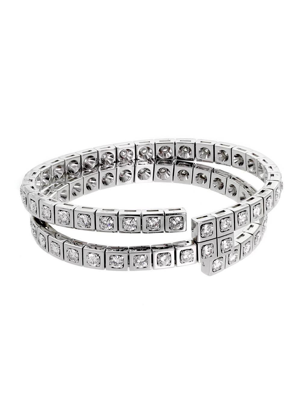 A chic diamond wrap bracelet by Cartier featuring 9.90cts appx of round brilliant cut vs quality diamonds set in 18k white gold. 

Inventory ID: 0000323