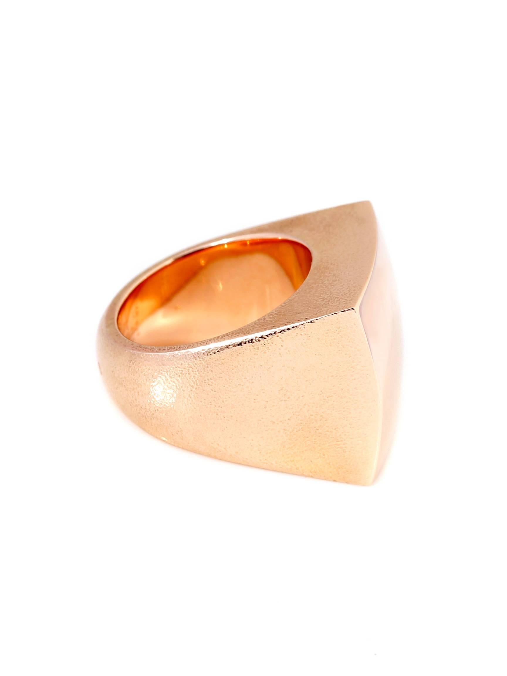 Hermes high polished top surface followed by textured sides rose gold 18k ring. The ring measures .70