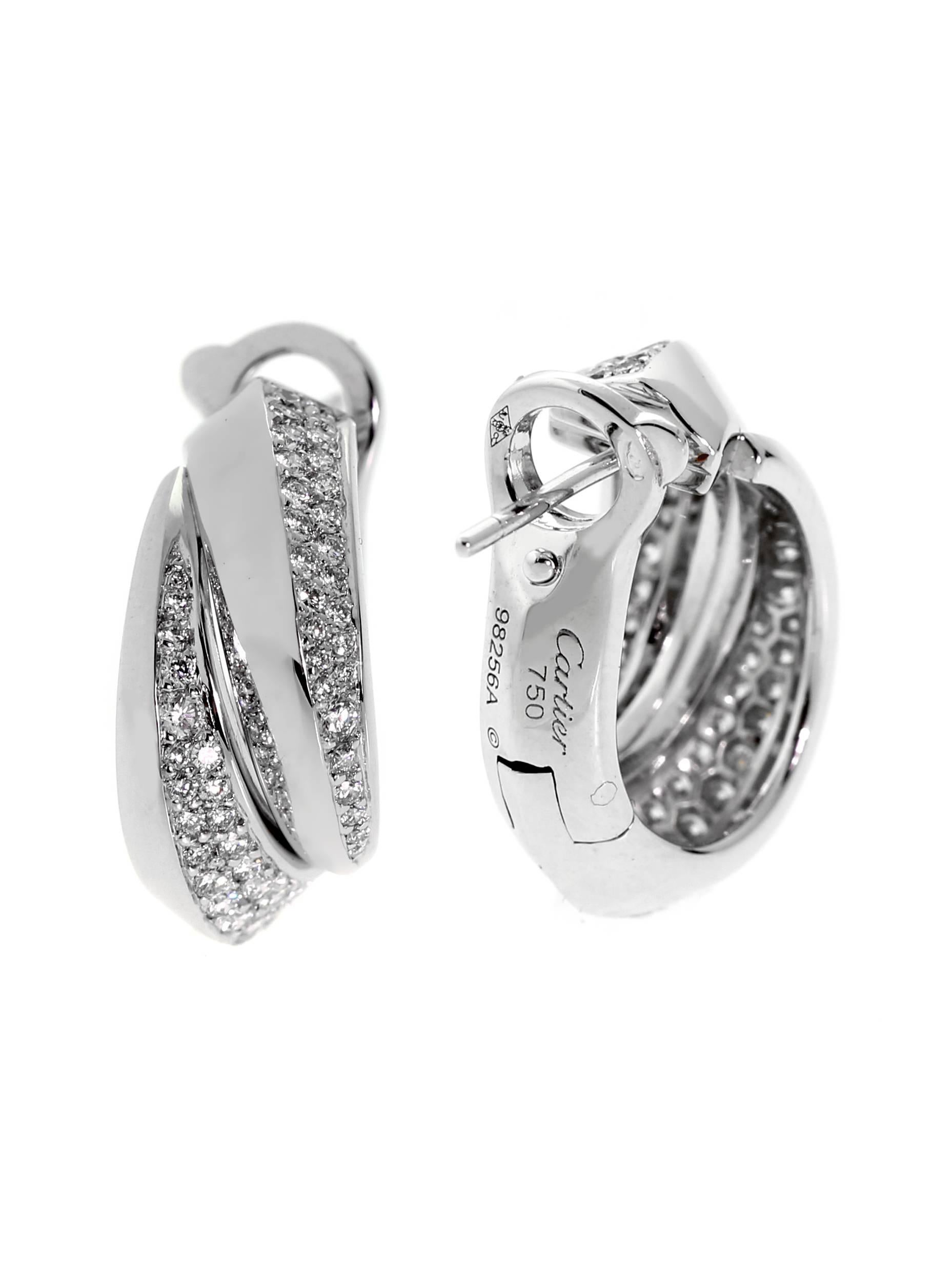 A chic pair of Cartier earrings from the Panthere collection featuring pave set round brilliant cut diamonds set in 18k white gold.

The earrings measure .39