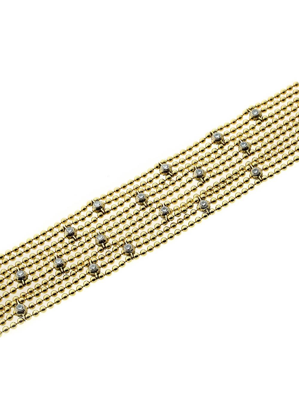 Cartier 18k yellow gold Draperie de Decollette bracelet adorned with 17 of the finest round brilliant cut diamonds

Length: 7 1/2″
Weight: 54 Grams
Dimensions: The bracelet measures .96″ Inches wide
Diamonds: 17 Round Brilliant Cut Diamonds