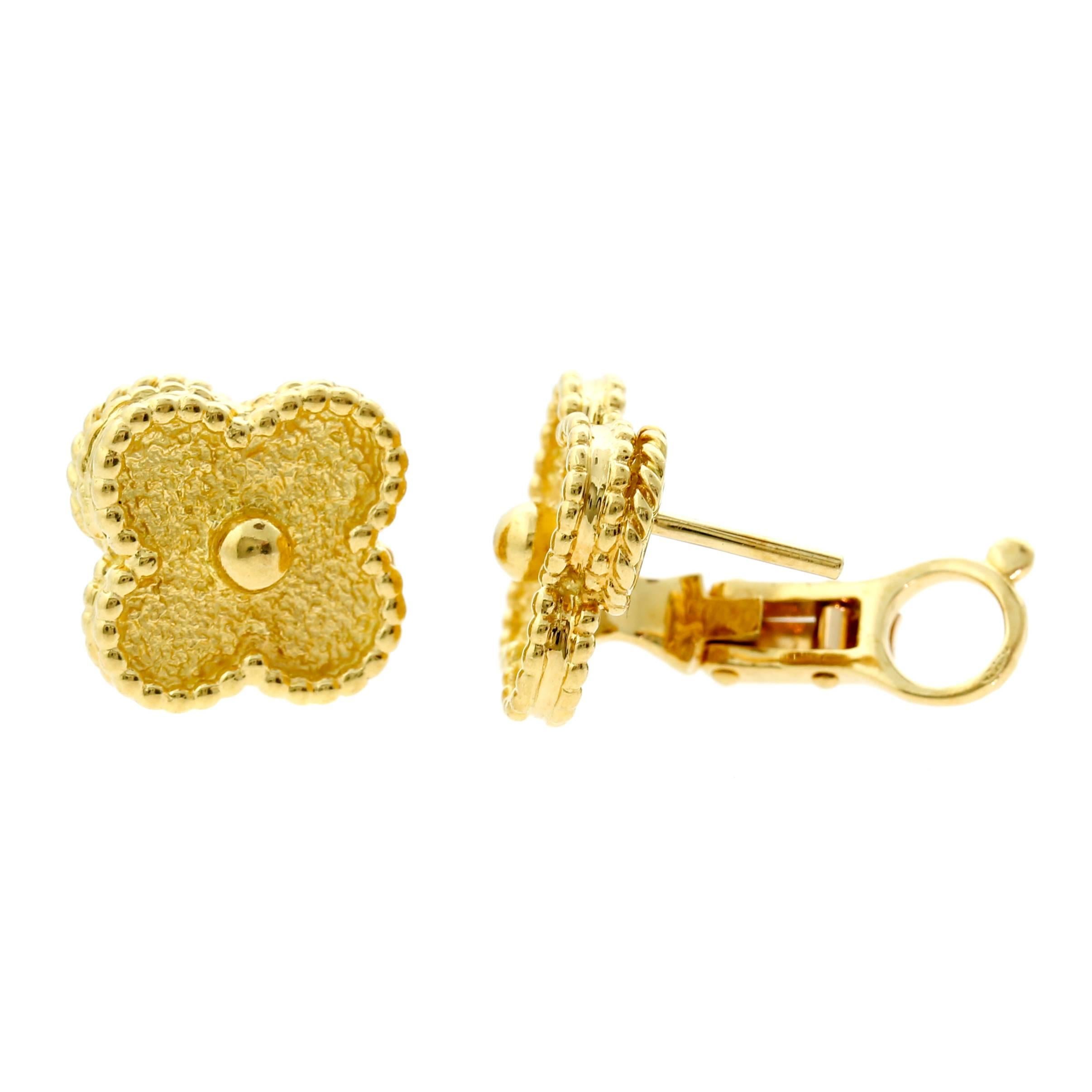 A chic pair of authentic 18k yellow gold Van Cleef & Arpels Vintage Alhambra earclips accompanied with the paperwork.

The earrings measure .59