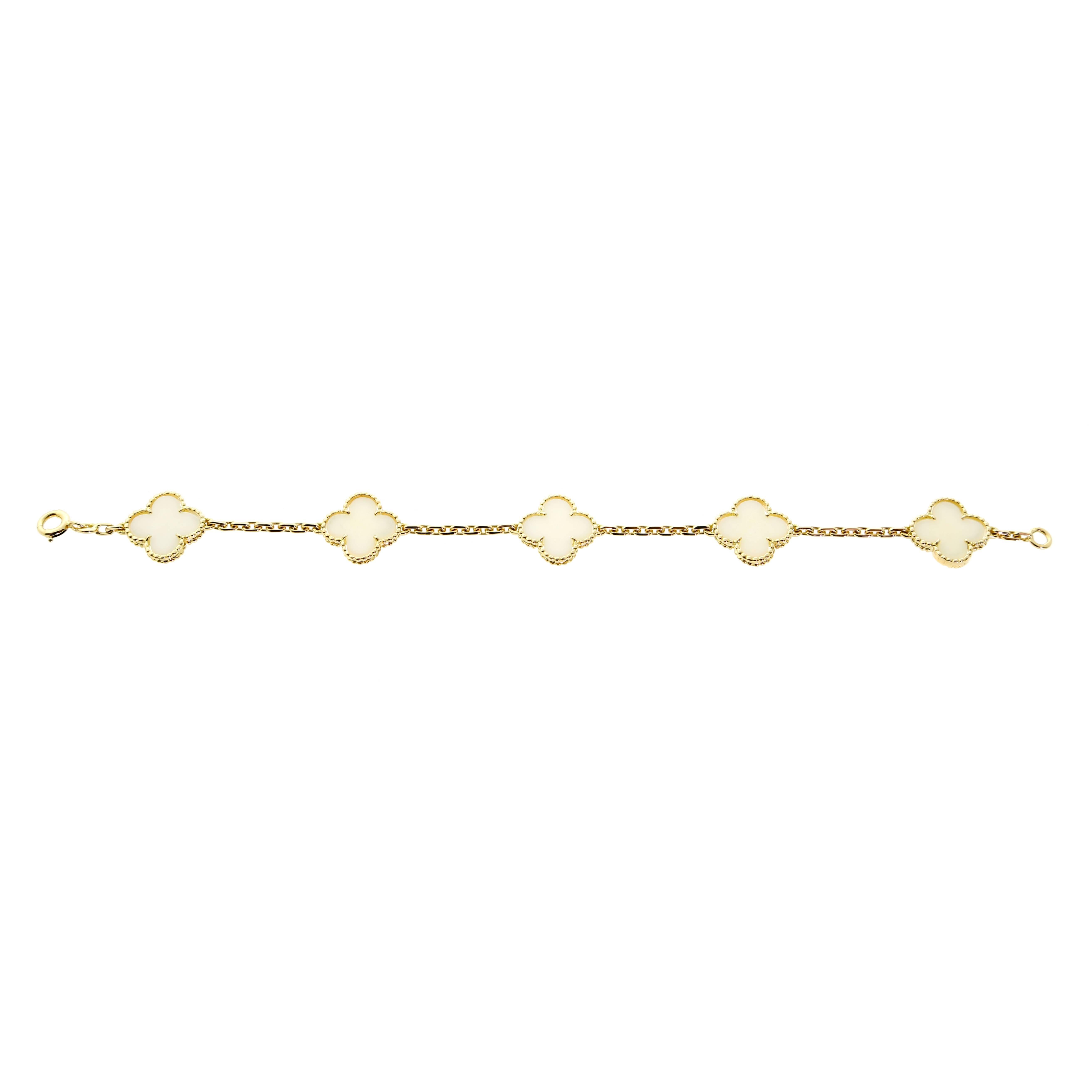 A magnificent vintage Van Cleef & Arpels 5 motif white coral Alhambra bracelet in 18k yellow gold.

Bracelet Length: 7.25