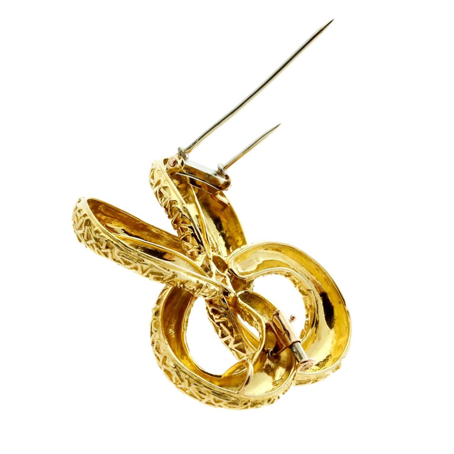 A stunning Van Cleef & Arpels gold brooch crafted in 18k yellow gold, may be worn as a necklace enhancer as well.