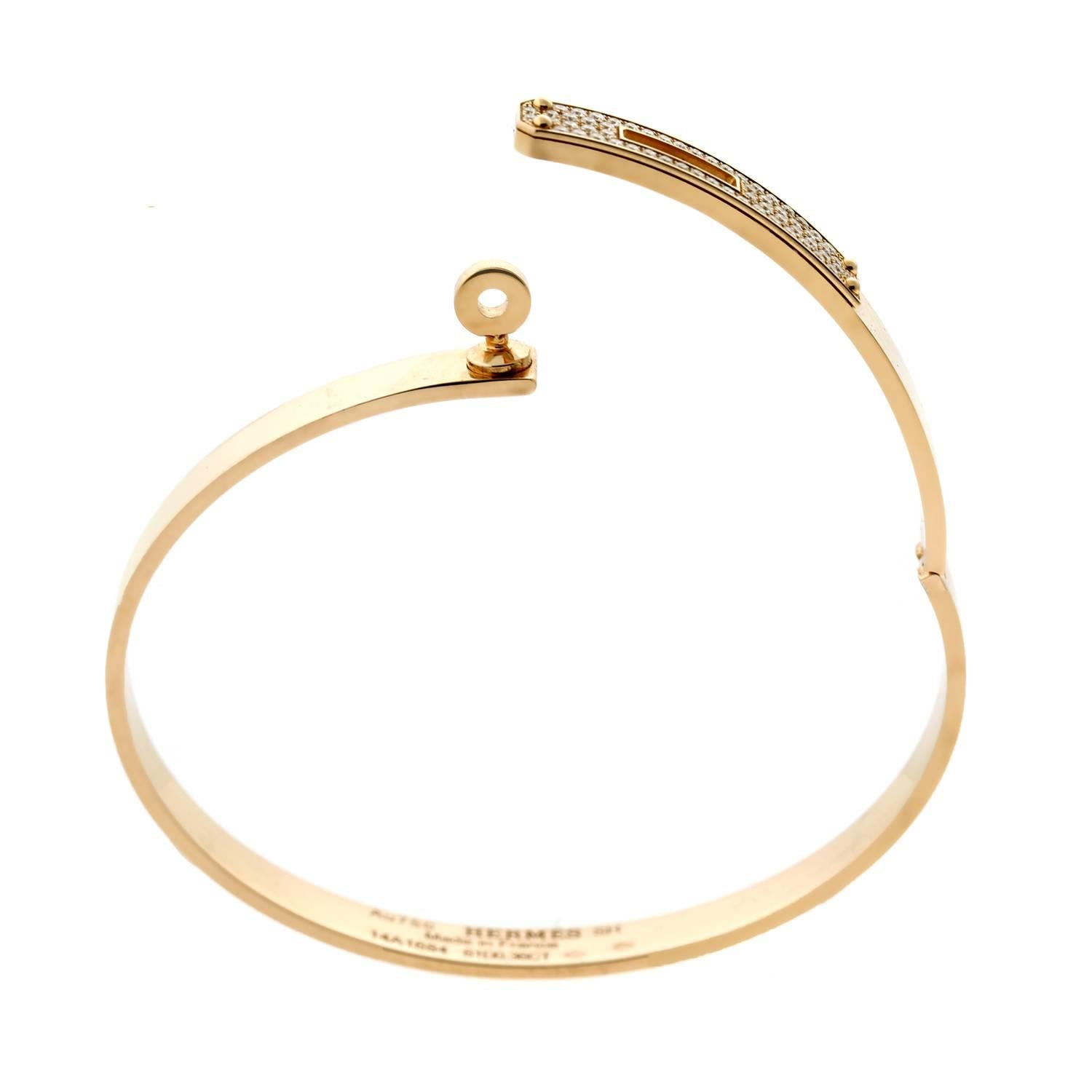 An iconic Hermes bangle bracelet from the Kelly collection crafted in 18k rose gold set with the finest Hermes round brilliant cut diamonds.

Size: Small (SH) Diamond Weight: .36ct

Inventory ID: 0000580