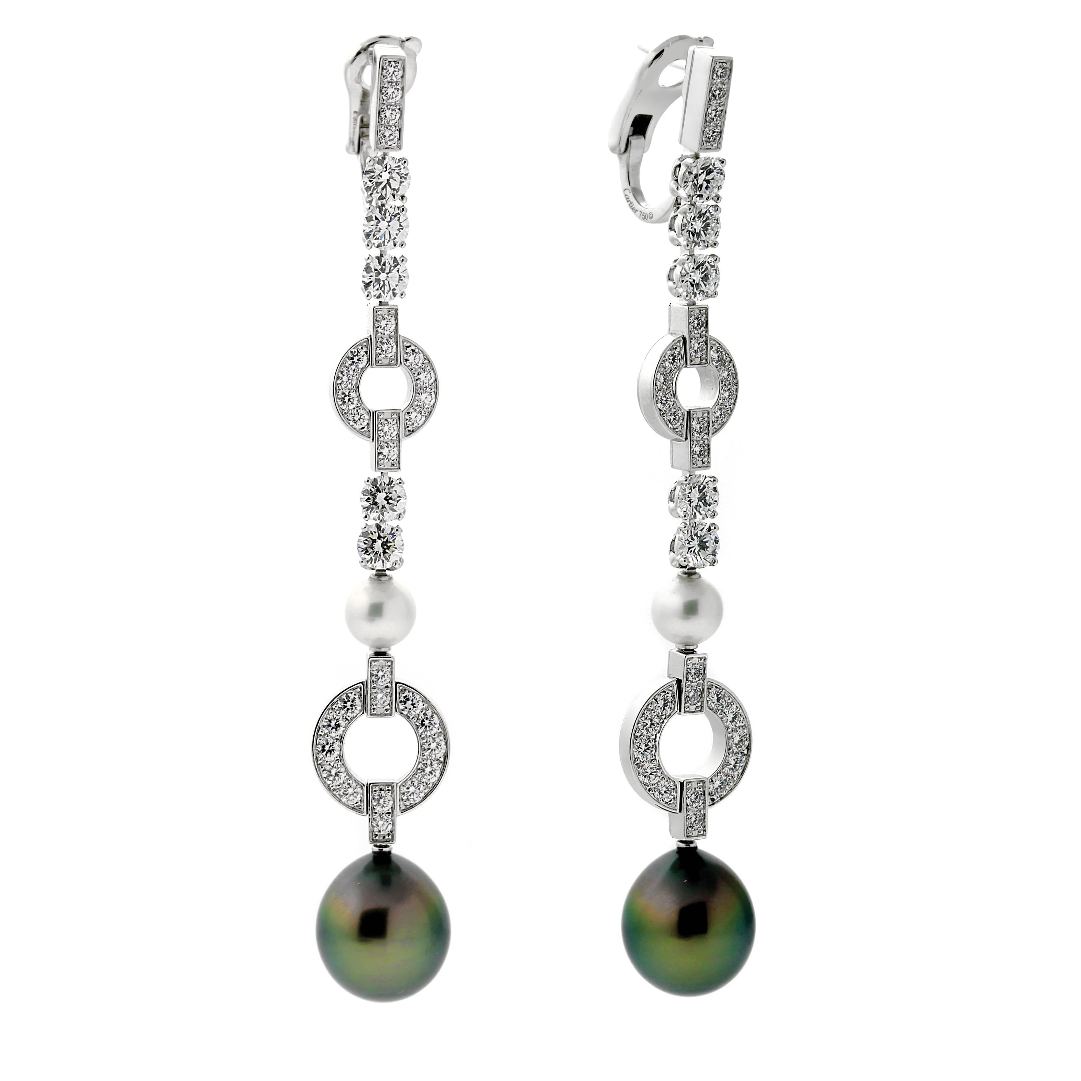 A stunning pair of Cartier diamond drop earrings featuring white and black pearls crafted in 18k White Gold. The earrings have a length of 3.25 Inches, and a weight of 24.5 grams

Cartier Est Retail: $58,000 + Tax
Inventory ID: 0000078