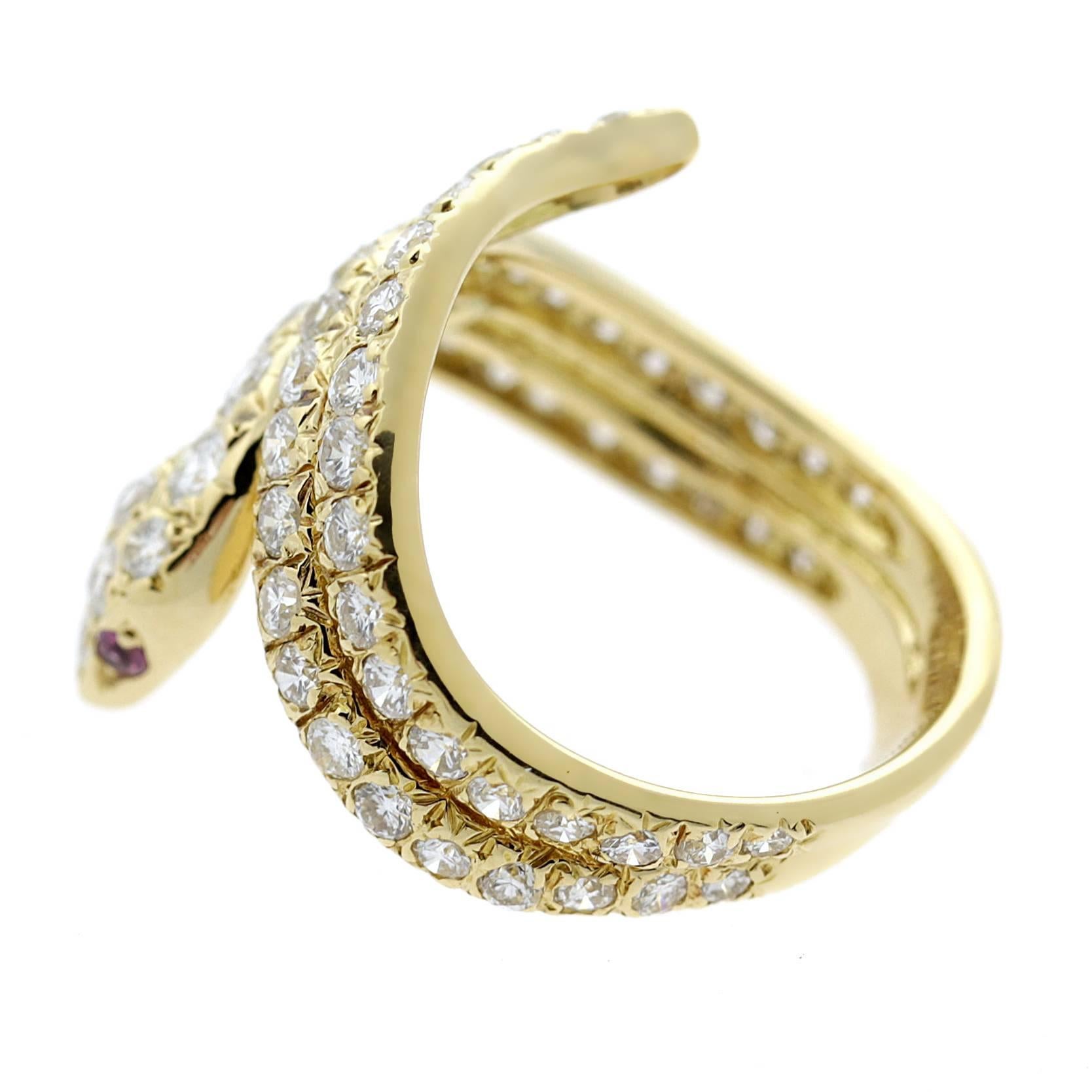 A magnificent Cartier ring featuring an alluring snake design paved with the finest Cartier round brilliant cut diamonds set in 18k yellow gold. 

Size: US 5
Ring Width: .82″ Inches

Inventory ID: 0000142