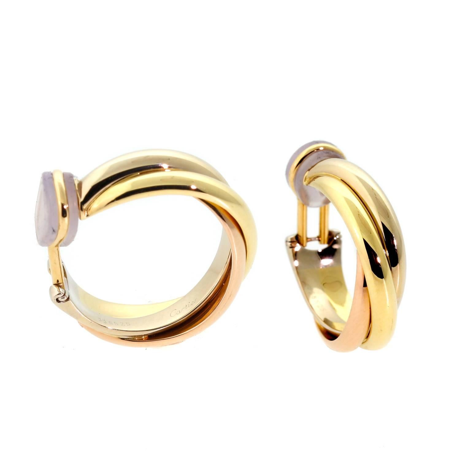 An pair of Cartier Trinity hoop earrings featuring 18k white yellow and rose gold to form this iconic look. Earring Width.27