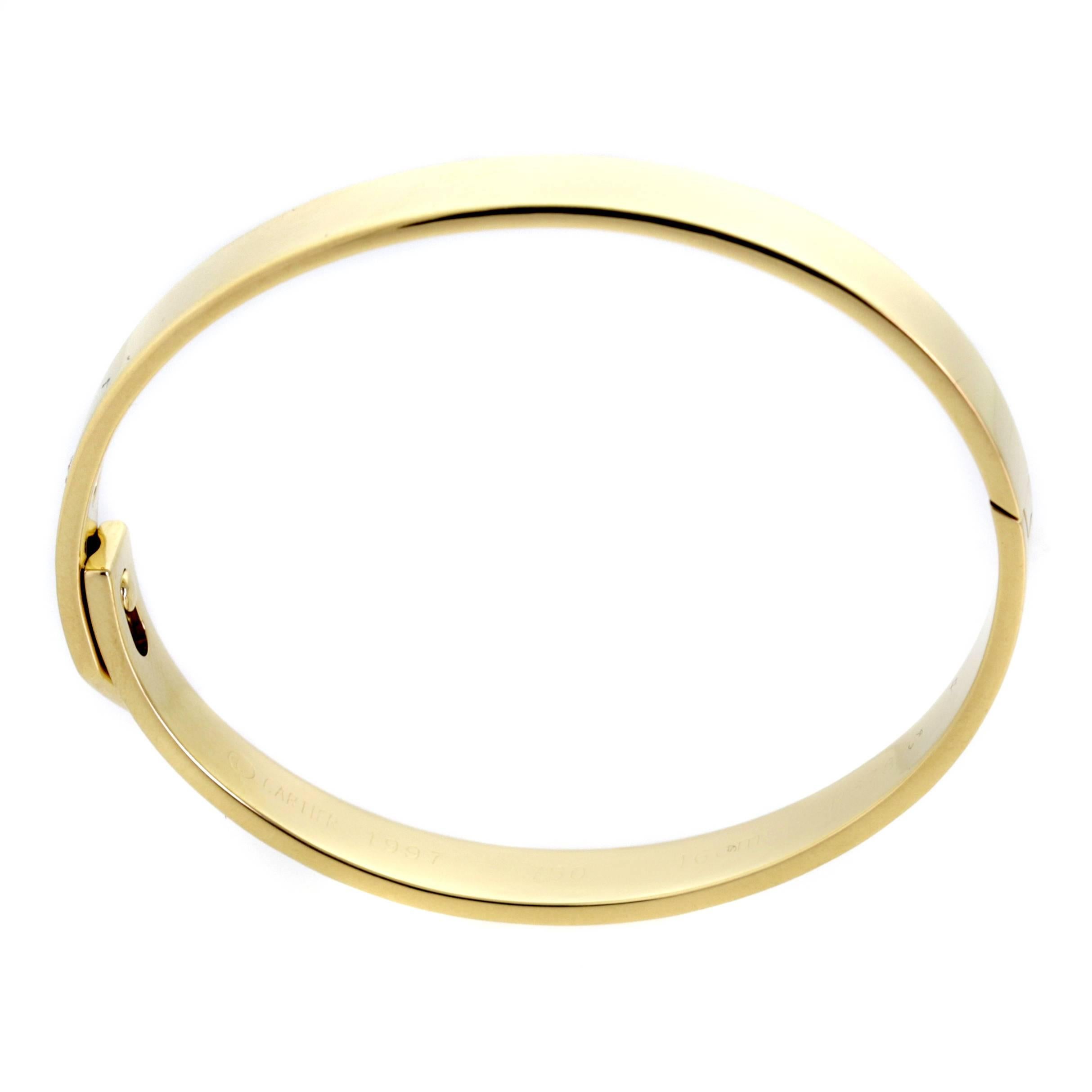 A chic authentic Cartier Anniversary bangle featuring a single .10ct Cartier round brilliant cut diamond set in 18k yellow gold. Bracelet Size: 16cm

Signed Cartier, 16cm, 1997, Unique Serial Number

