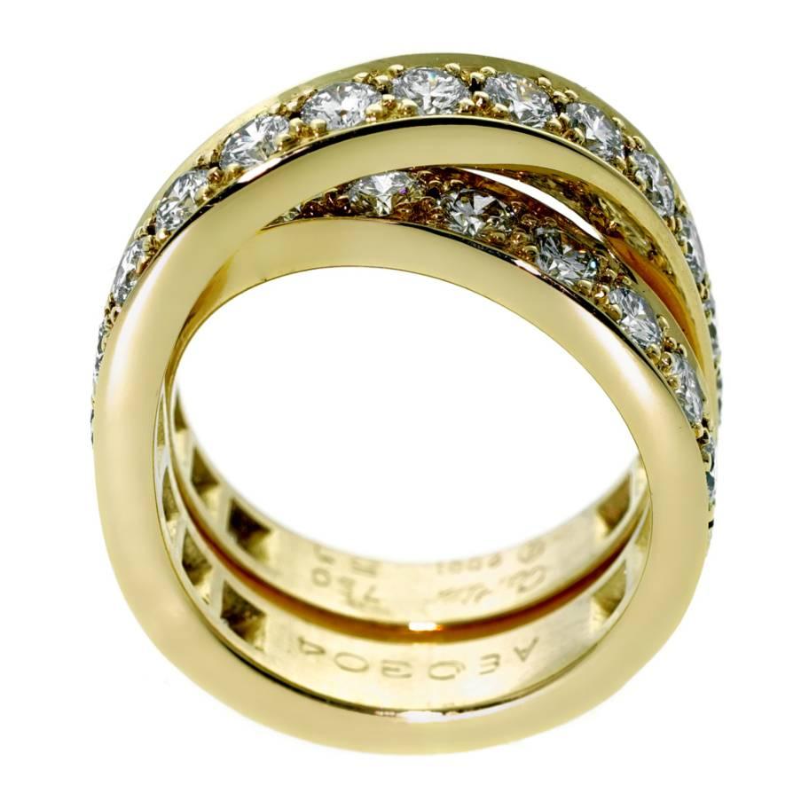 A magnificent 18k yellow gold Cartier bypass style ring set with the highest quality Cartier round brilliant cut diamonds totaling 2.24ct. Size: EU 51 / US 5 1/2 (Resizeable)

Opulent Jewelers Sku: 146