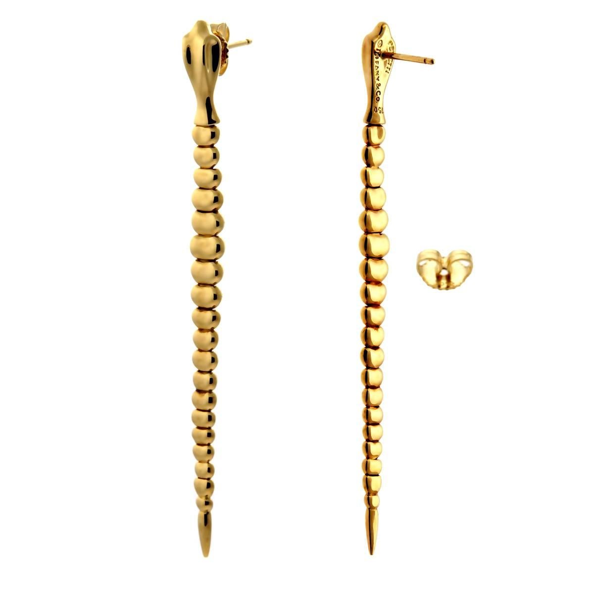 A chic pair of authentic Tiffany & Co snake motif earrings, these vibrant earrings are crafted in 18k yellow gold and feature a free flowing design.

Length: 2.75