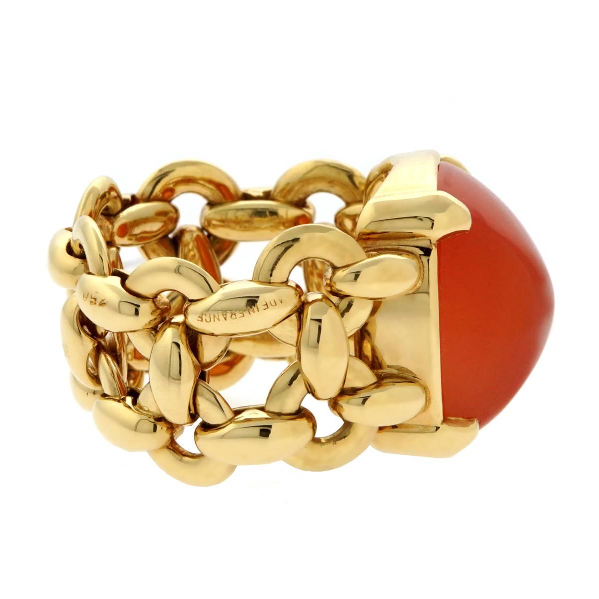 A fantastic Hermes chain link design ring in 18k yellow gold featuring a sugar loaf Carnelian. Size 5 3/4 