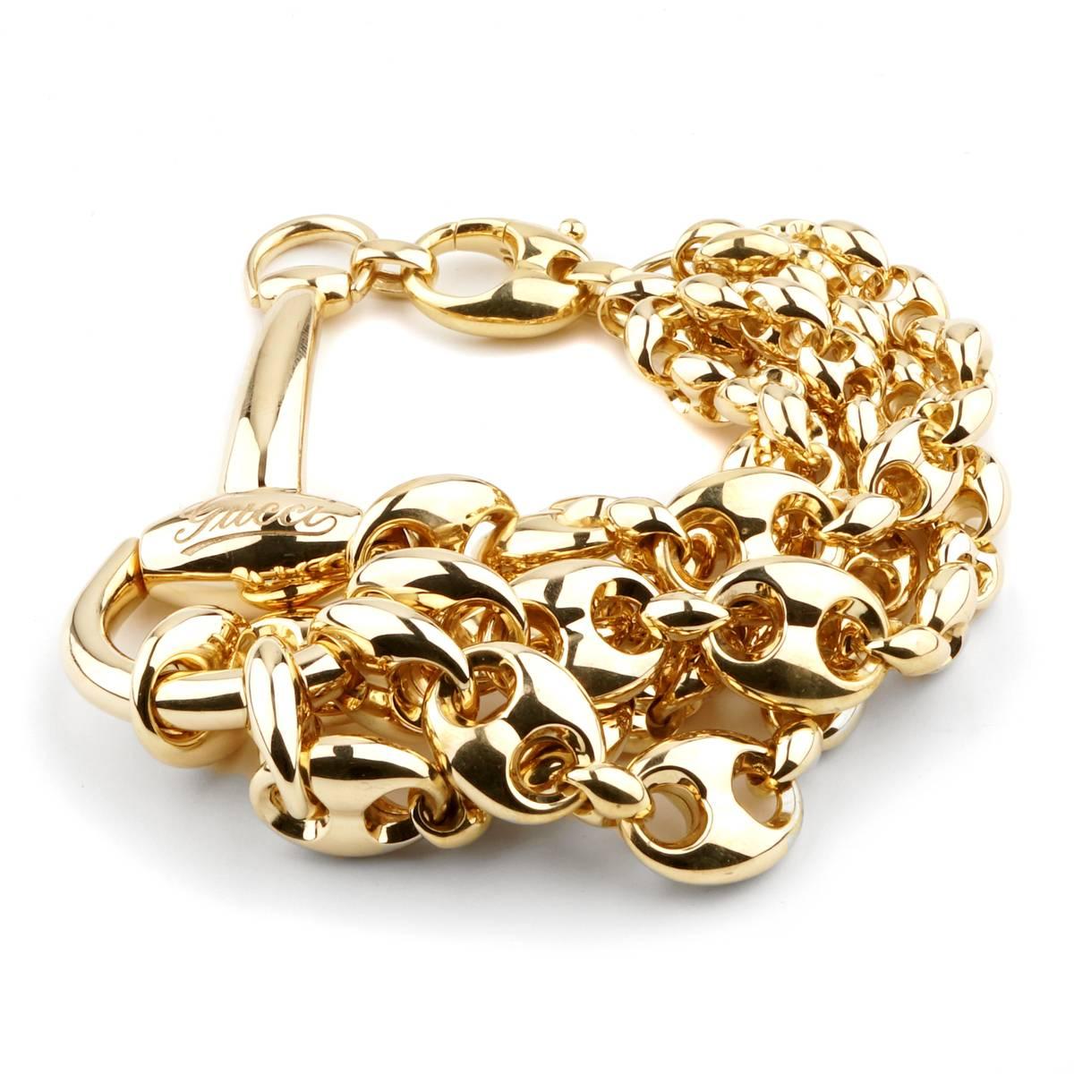 A magnificent Gucci bracelet featuring a Horsebit motif attaching 5 cascading Gucci link yellow gold bracelets crafted in 18k yellow gold. Length: 8