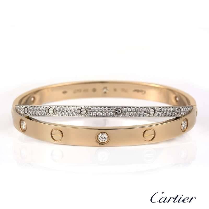 A double Cartier 18k rose and white gold Love bangle. The predominant 18k rose gold bangle is set with 6 round brilliant cut diamonds and alternating screw motifs. Interlinking is a fully diamond paved 18k white gold band on either side also