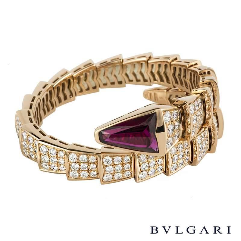 An impressive 18k rose gold bracelet from the Serpenti collection by Bvlgari. The bracelet is in the form of a serpent wrapping around the wrist, composed of 26 graduating flexible pave set intersections. Each intricate link is set with round