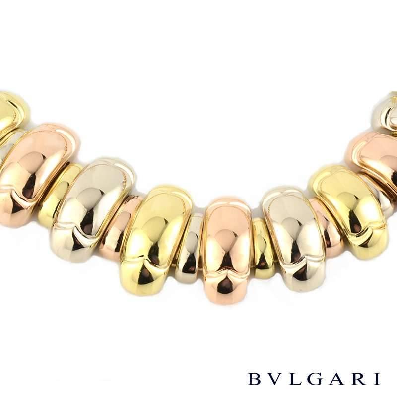 A beautiful 18k 3 colour gold flexi link necklace by Bulgari. The necklace comprises of alternating 18k yellow, rose and white gold polished finish flexi domed link panels with open work detail on the reverse of each link and is complemented with a