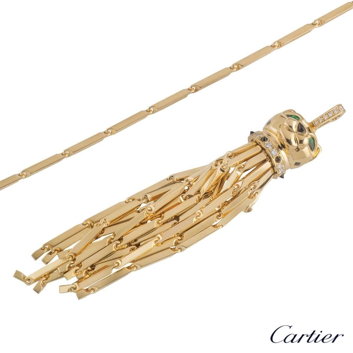 A spectacular 18k yellow gold Panthere Sautoir necklace by Cartier. The necklace features a Panthere's head, with emeralds set to the eye's and black onyx to the nose, complimented with black lacquer detailing. The necklace has diamonds set to the