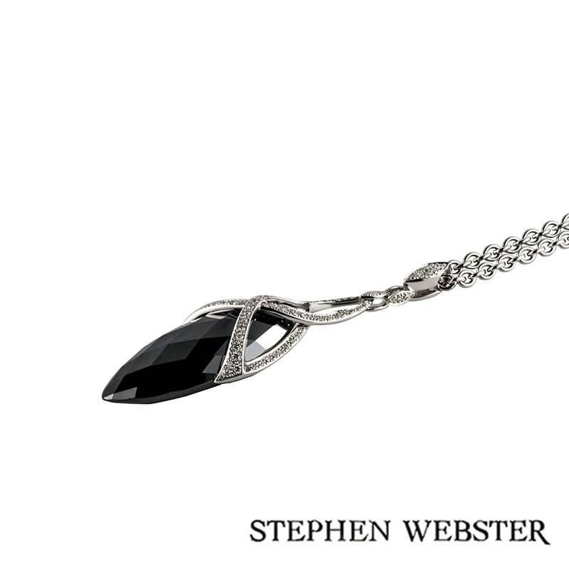 An 18k white gold hematite and diamond drop pendant from the Jewelvine collection by Stephen Webster. The pendant is composed of a marquise shape, briolette hematite weighing approximately 23.44ct, complemented by open work detailing set to top