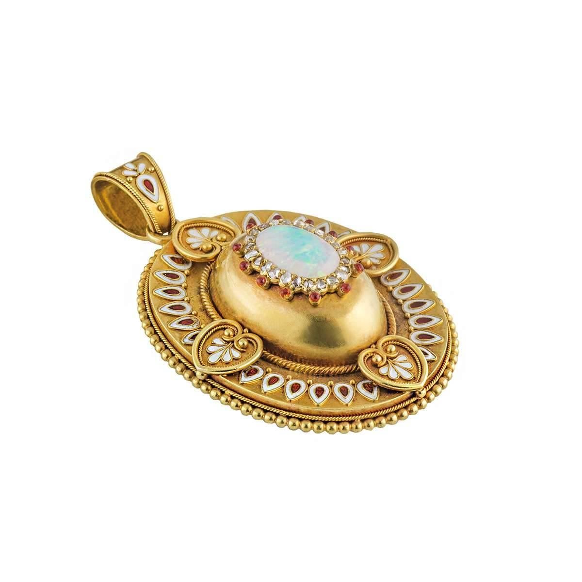 A stunning opal, diamond and enamel locket pendant, circa 1880's. The pendant is set to the centre with a raised dome set with a single cabochon opal, with a halo of 24 rose cut diamonds totalling approximately 0.48ct. The pendant has filigree red
